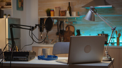 Professional setup for recording podcast in home studio of vlogger. Influencer recording social media content with production microphone. Digital web internet streaming station