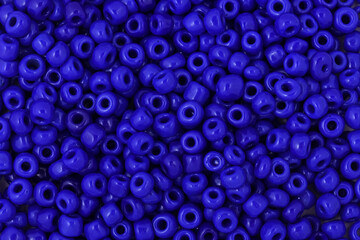 Blue Beads on the white background. Background or texture of beads. Close up, macro,It is used in finishing fashion clothes. make bead necklace or string of beads for woman of fashion.