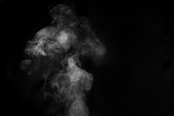 Smoke fragments on a black background. Abstract background, design element, for overlay on pictures