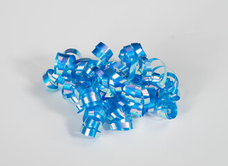 Shiny, festive iridescent blue ribbon, for special occasion, including Wedding and Christmas, on white background