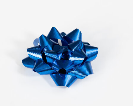 Shiny, festive blue bow for special occasion, on white background