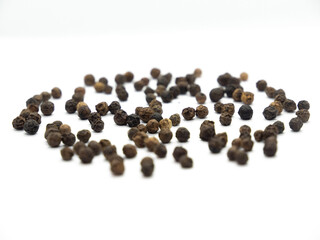 Black pepper background, herbs, spices in front view.