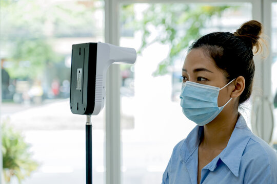 The Asian Tourist Woman Has Checked Body Temperature With A Thermal Temperature Scanner Detector Travel Safety