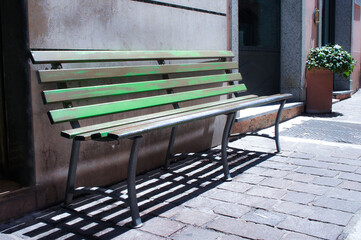 bench in front of a wall