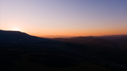 Fototapeta na wymiar Sun setting over hills. Carpathian mountains in Ukraine.
