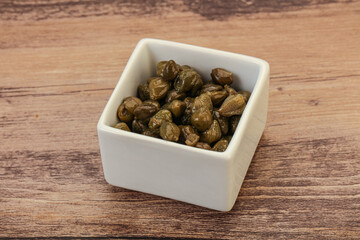 Tasty capers in the bowl