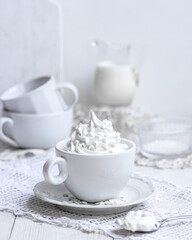 Obraz na płótnie Canvas White meringue cream in a cup
