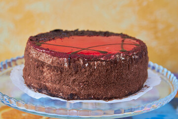 chocolate cake with gelatin,chocolate cake on a glass tray on the table