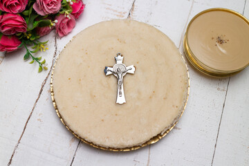 Pesaha Appam, Bread ,Paal religious Christian food on Maundy Thursday, Happy, Good Friday with rice flour Kerala India. Palm Sunday, Easter Sunday. Top view cross of coconut palm leaf white background