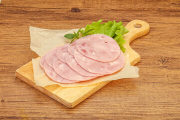 Slised ham snack over board