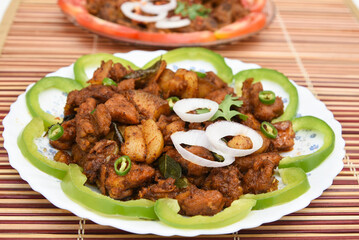 Spicy hot meat curry from Kerala India. beef buffalo pork pig lamb masala curry vindaloo. Indian food served rice, appam popular Lankan, Thailand, Malaysia, Asian. Indian spices, goulash, fry