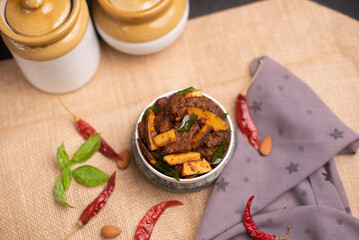 Spicy hot meat curry from Kerala India. beef buffalo pork pig lamb masala curry vindaloo. Indian food served rice, appam popular Lankan, Thailand, Malaysia, Asian. Indian spices, goulash, fry