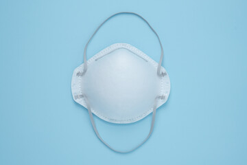 Corona virus prevention face mask protection N95 masks isolated on blue background, N95 respirators or surgical masks protective against Coronovirus Covid-19, Health care and surgical concept.