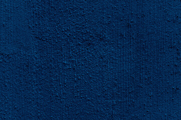 Abstract grunge navy blue cement wall textured or Dark blue rough concrete surface background