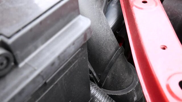 Nissan pulsar car engine dirty carburetor pipe closeup 