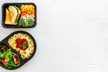Lunch boxes with meal. Food delivery concept. Overhead view