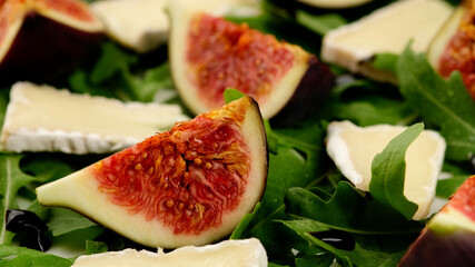 very delicious salad figs, camembert, arugula. Healthy food