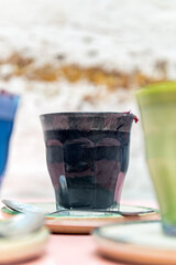 Glasses of Super Lattes such as Butterfly Matcha from organic blue matcha and nut milk, Rose Matcha from green tea powder infused with rose water, Black Latte from activated charcoal, date syrup