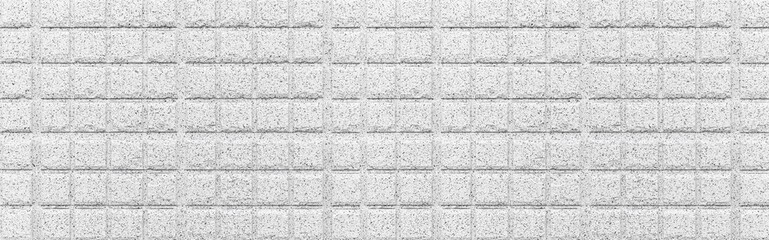 Panorama of white stone block wall seamless background and pattern texture