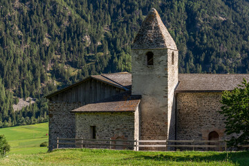 The ancient Church of St. Johann in Tubre, Taufers im Münstertal, South Tyrol, Italy, typical alpine mountain church