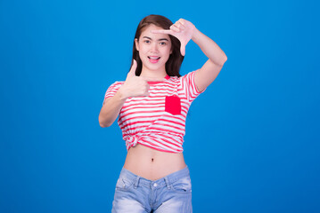 Portrait of beautiful asia young woman, on blue color background with copy space. Human face expressions, emotions feelings, body language,beauty and fashion concept.