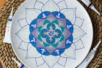 Unfinished decorative plate or platter, painted with blue, violet, grey and green acrylic paint