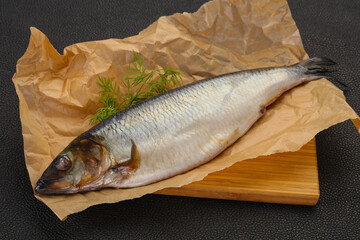 Salted herring over the wooden board
