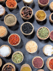        spices background, top view. glasses of spices.    