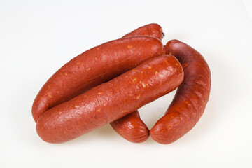 Tasty meat sausages over white background