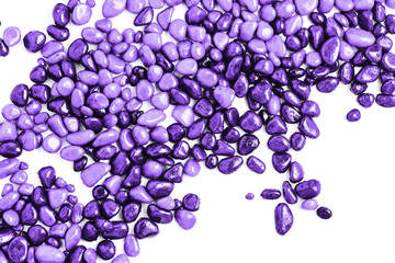 texture of stones on a white background. beautiful purple pebbles in water drops. top view, flat lay