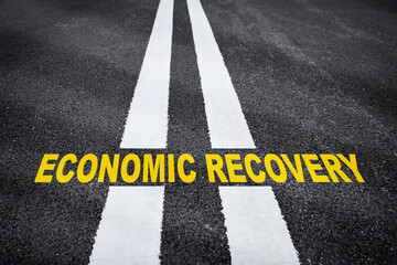 Economic recovery word on road. Business cycle stage concept and pandemic crisis idea
