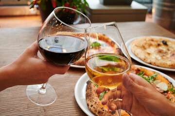 Pizza and glass of light and dark wine