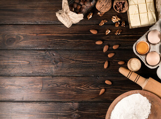 Ingredients for baking on a wooden background top view