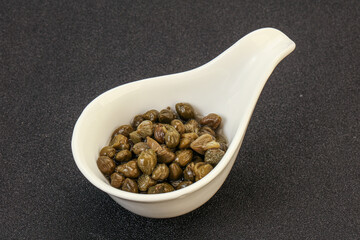 Tasty capers in the bowl