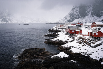Famous tourist sightseeing Hamnoy fishing village on Lofoten Islands, Norway with red rorbu houses