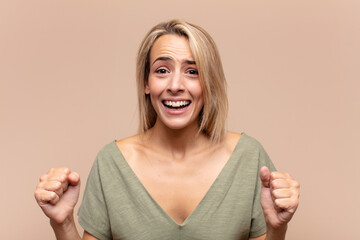  feeling shocked, excited and happy, laughing and celebrating success, saying wow!