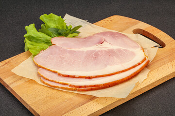 Sliced pork belly over board