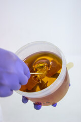 Can on liquid sugar for skin epilation.