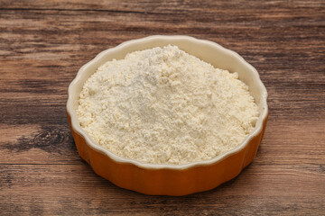 Wheat flour heap in the bowl