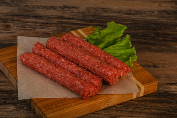 Raw beef sausages with spices