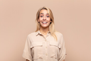  looking happy and pleasantly surprised, excited with a fascinated and shocked expression