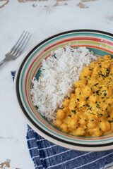 chickpeas with curry accompanied by basmati rice