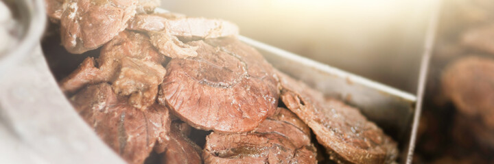 Stewed beef in a boiling pot. Selective focus