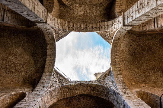 Inside architecture ceiling with opening. Arches of an ancient medieval church ruin with blue sky in Visby Gotland Sweden. Historical ruins with free entry.