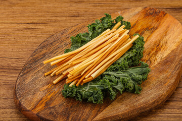 Chechel cheese sticks over board