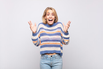  feeling happy, excited, surprised or shocked, smiling and astonished at something unbelievable