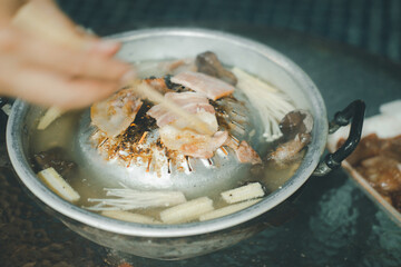 Pork or meat and vegetable grilling in pan on the stove
