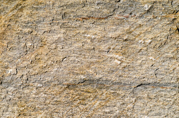 Granite slab, with yellow and brown shades, due to ferrite, which create chromatisms of the various mineral crystals, these stones decorate buildings in many cities. texture