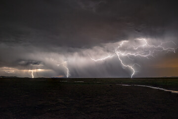 Naklejka na ściany i meble Lightening from a monsoon in southern Arizona