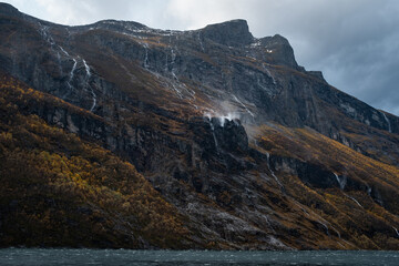 Fototapeta na wymiar Rocky Cliffs with Waterfalls of Geirangerfjord Norway